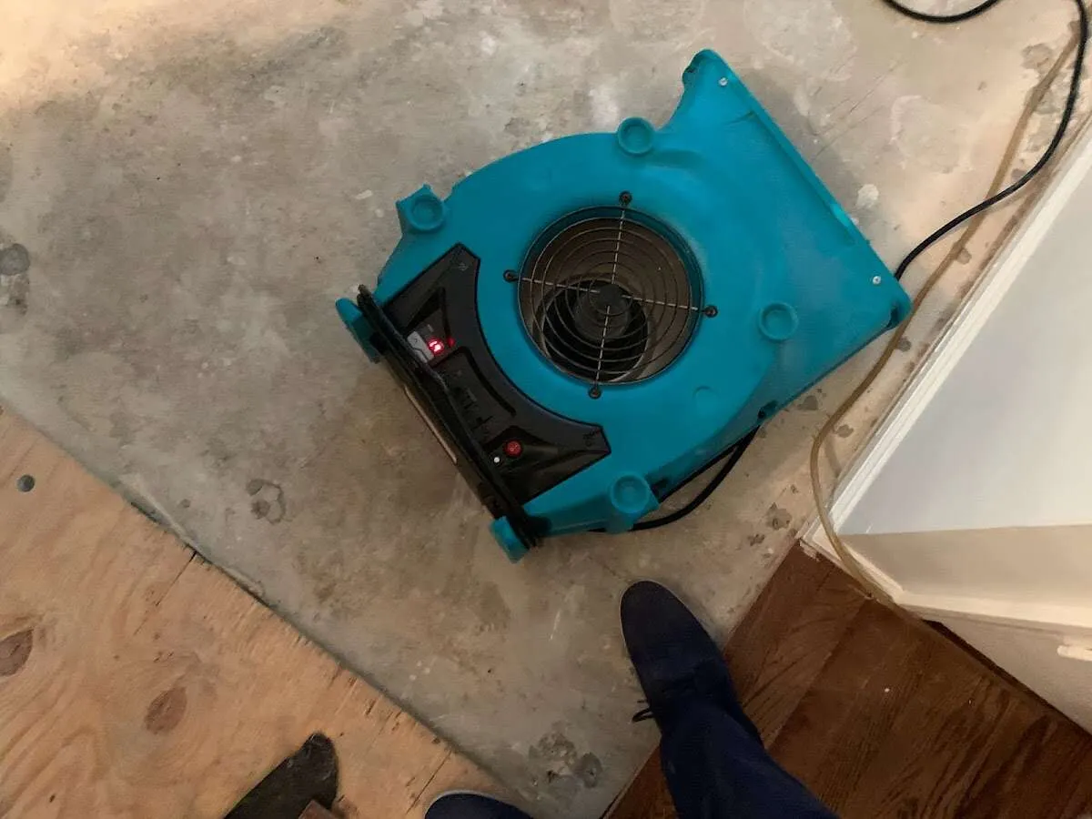 Air mover drying subfloor during Commercial Water Damage Restoration in Wetumpka
